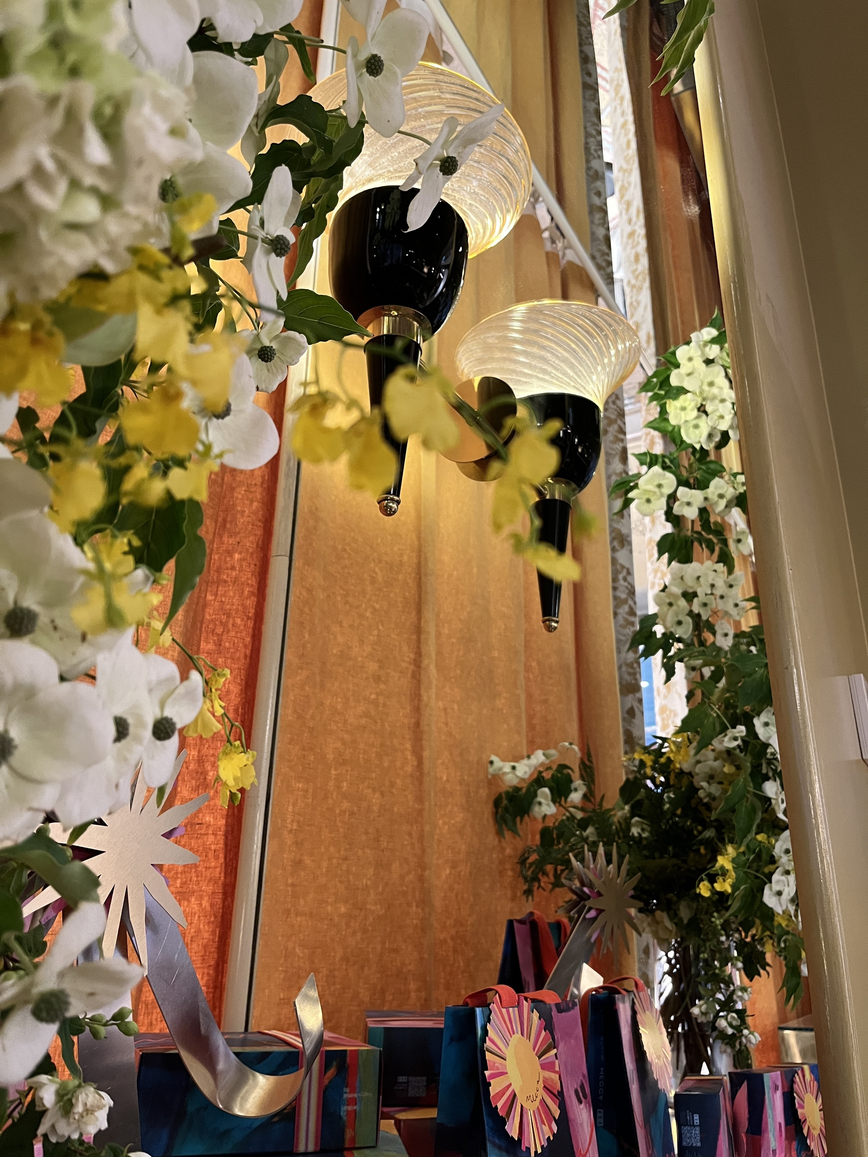 Flowers and gift bags, perhaps a wedding scene?