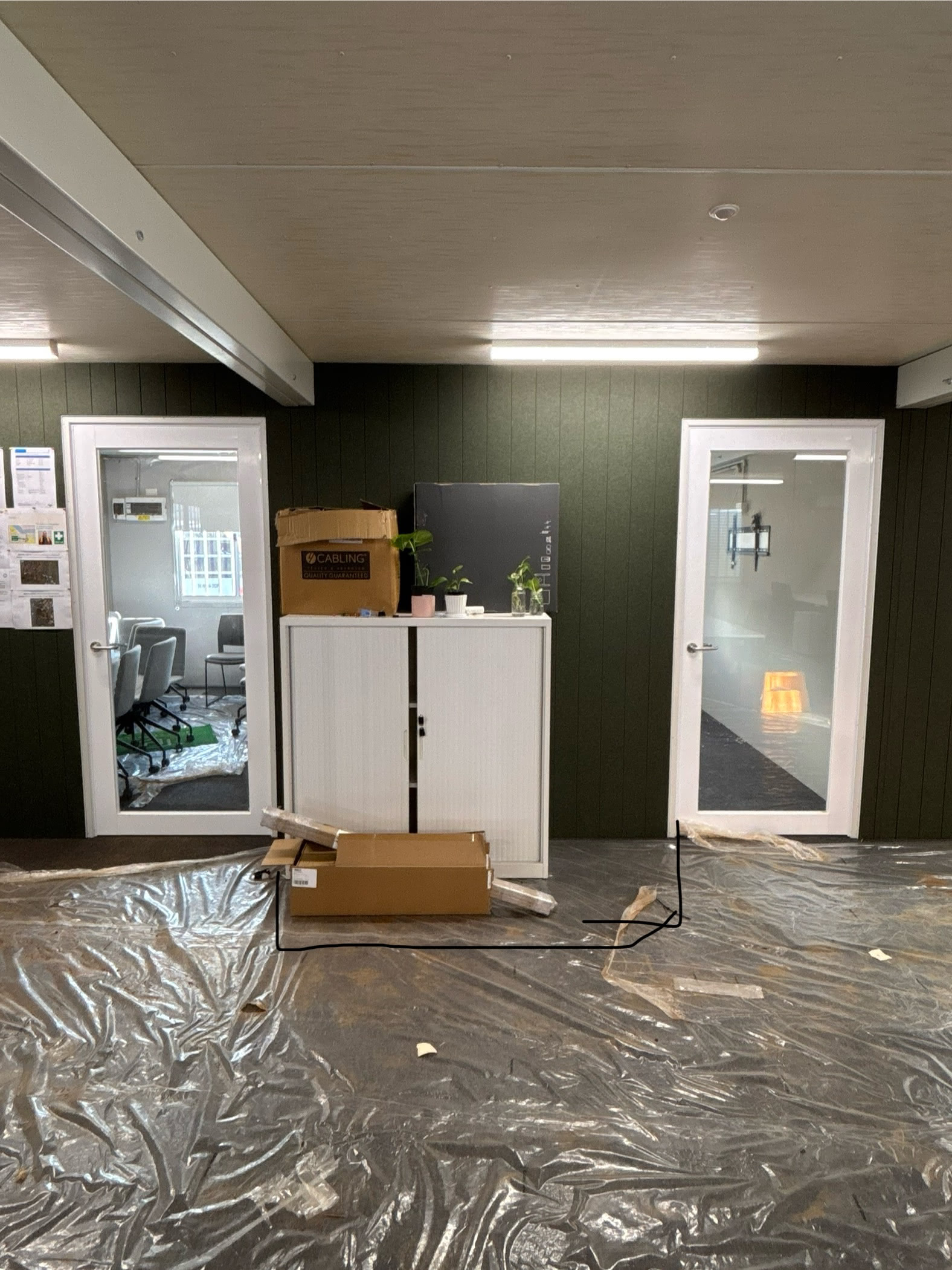 Green wall from further out, doors visible